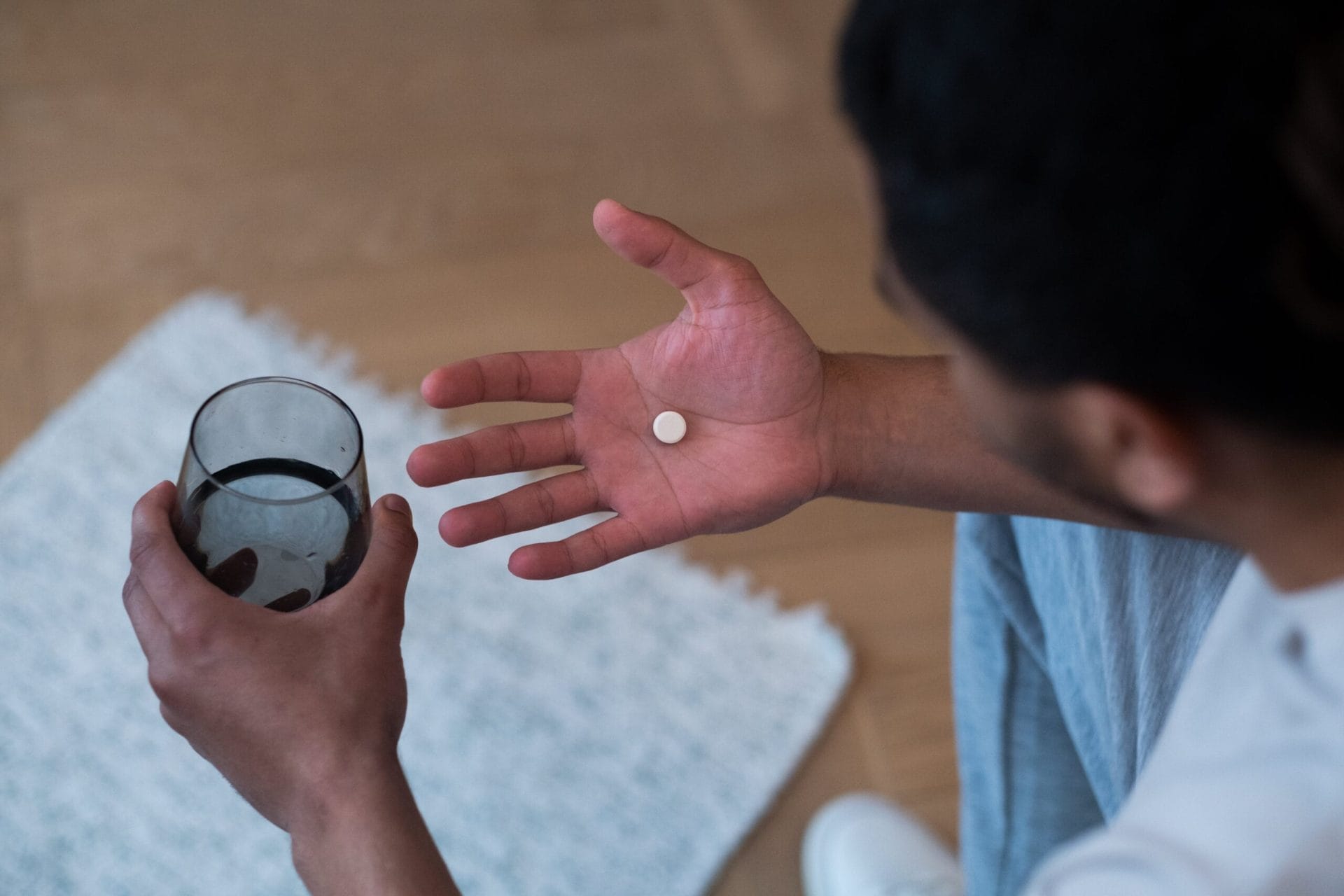 a man drinking medicine